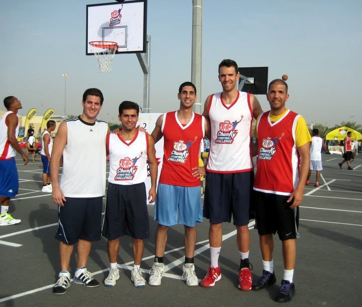 Brian Sigafoos with teammates at an outdoor 3-on-3 basketball tournament in Dubai